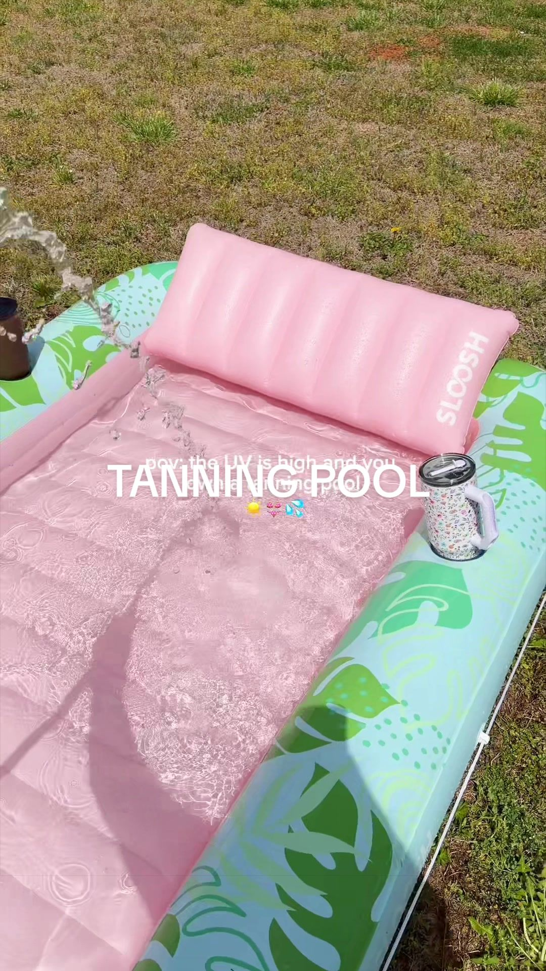 Inflatable tanning lounge being filled with water