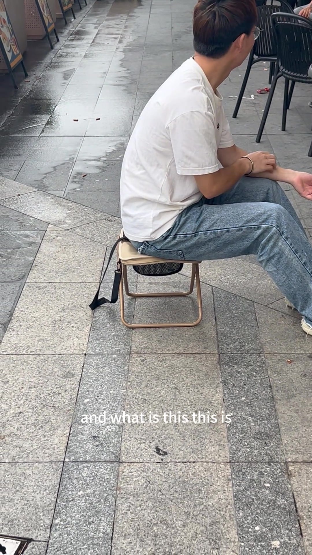 Customer carrying the folding stool as a shoulder bag