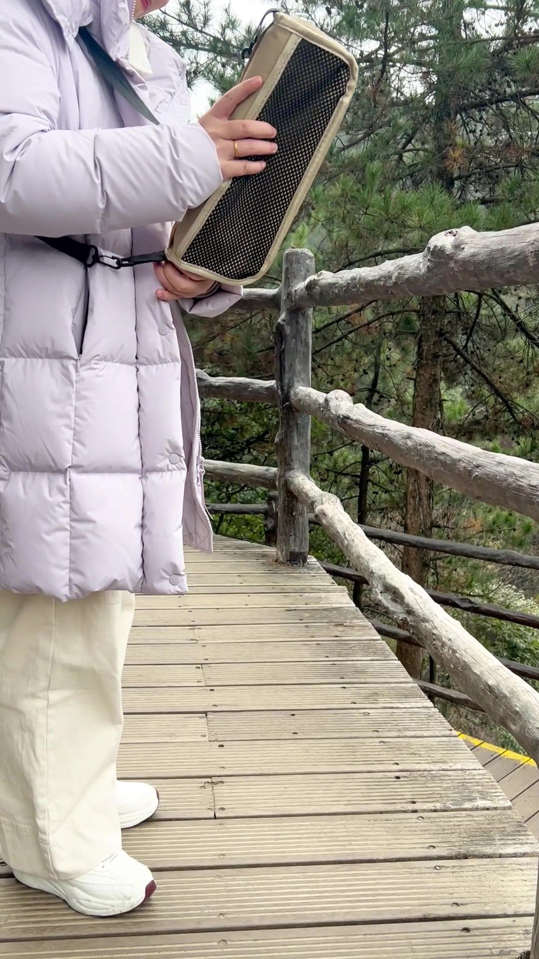 Customer using the stool bag side pocket for small items