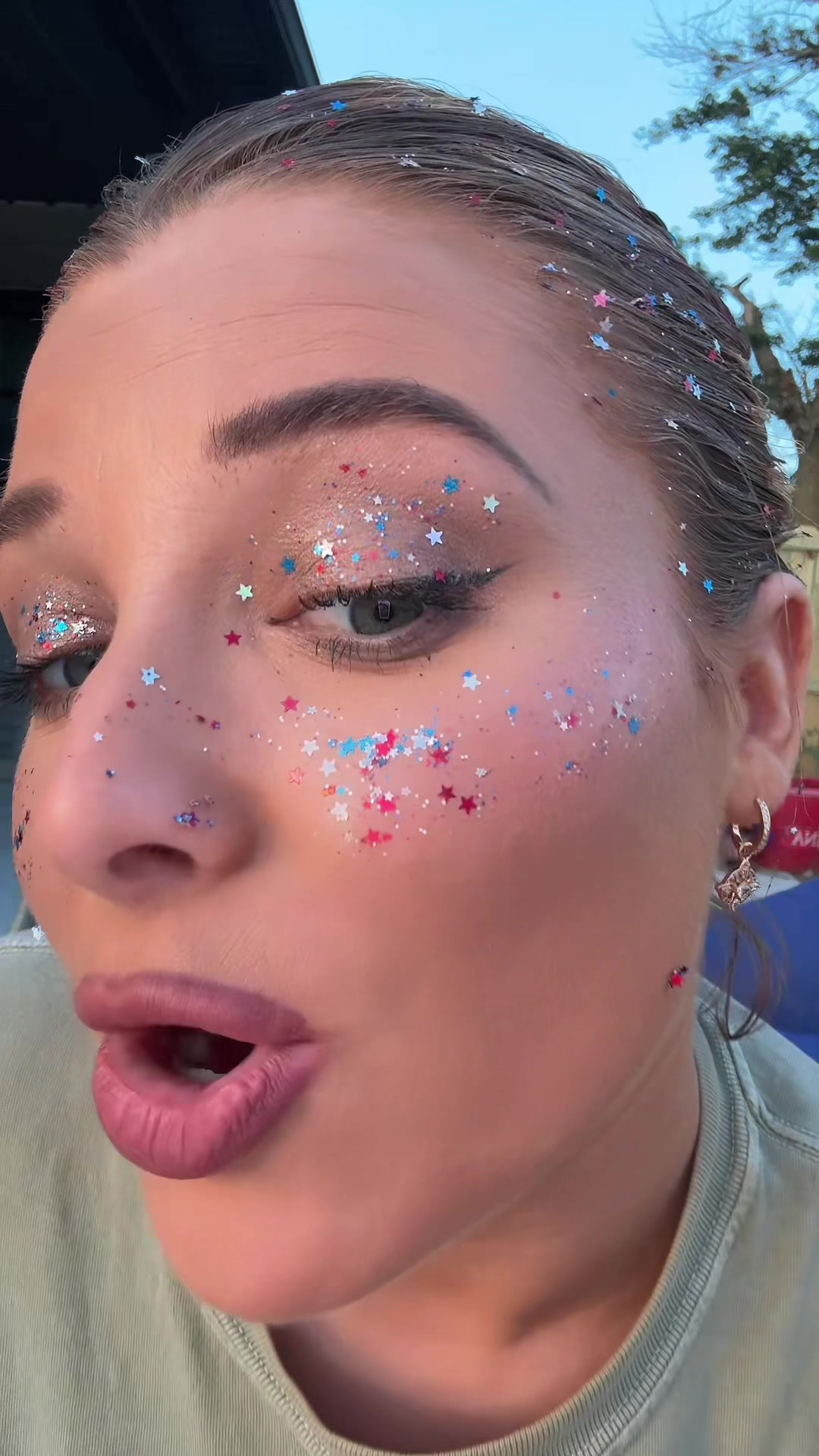 Glitter freckles look on cheek