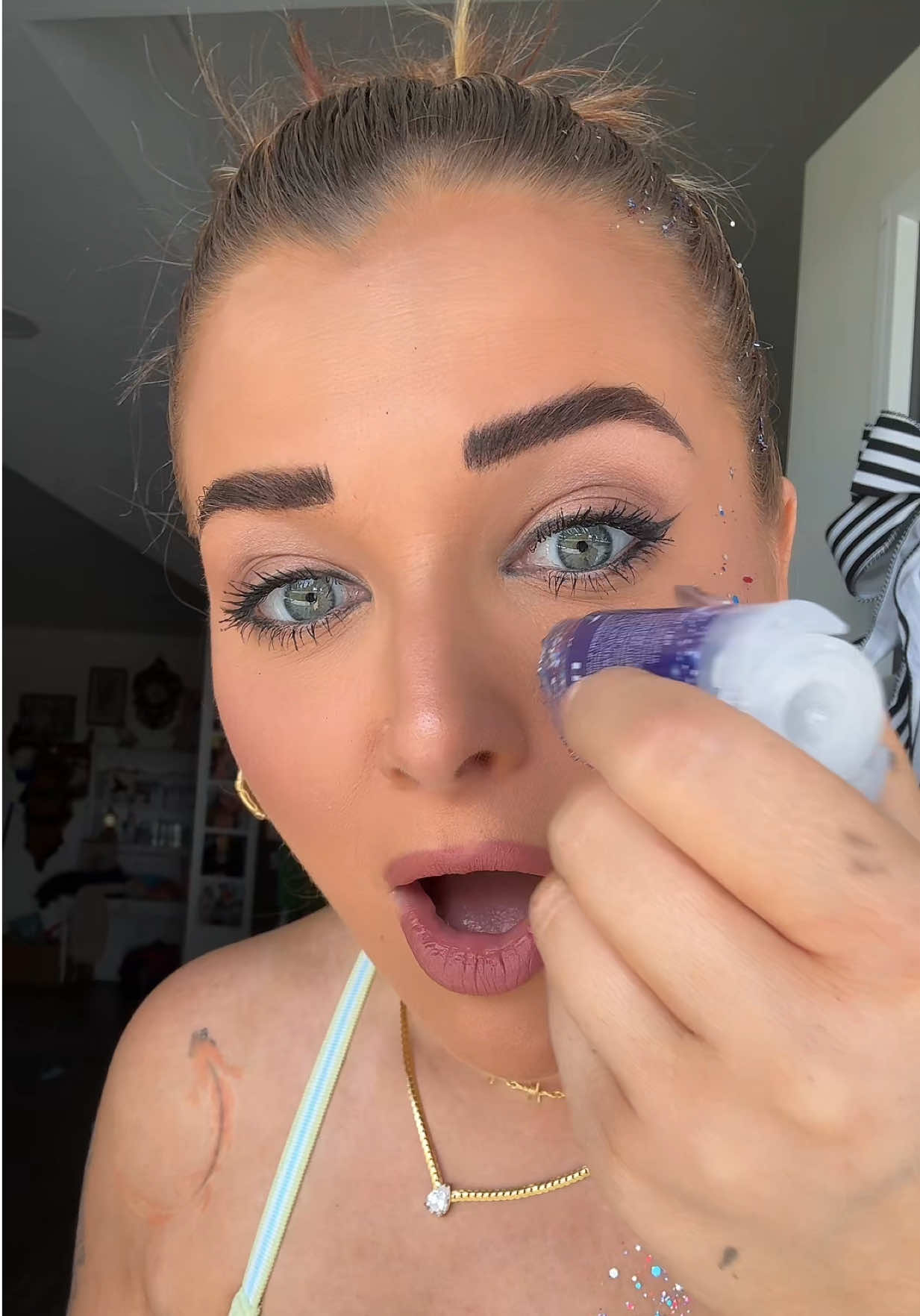 Glitter stick application closeup