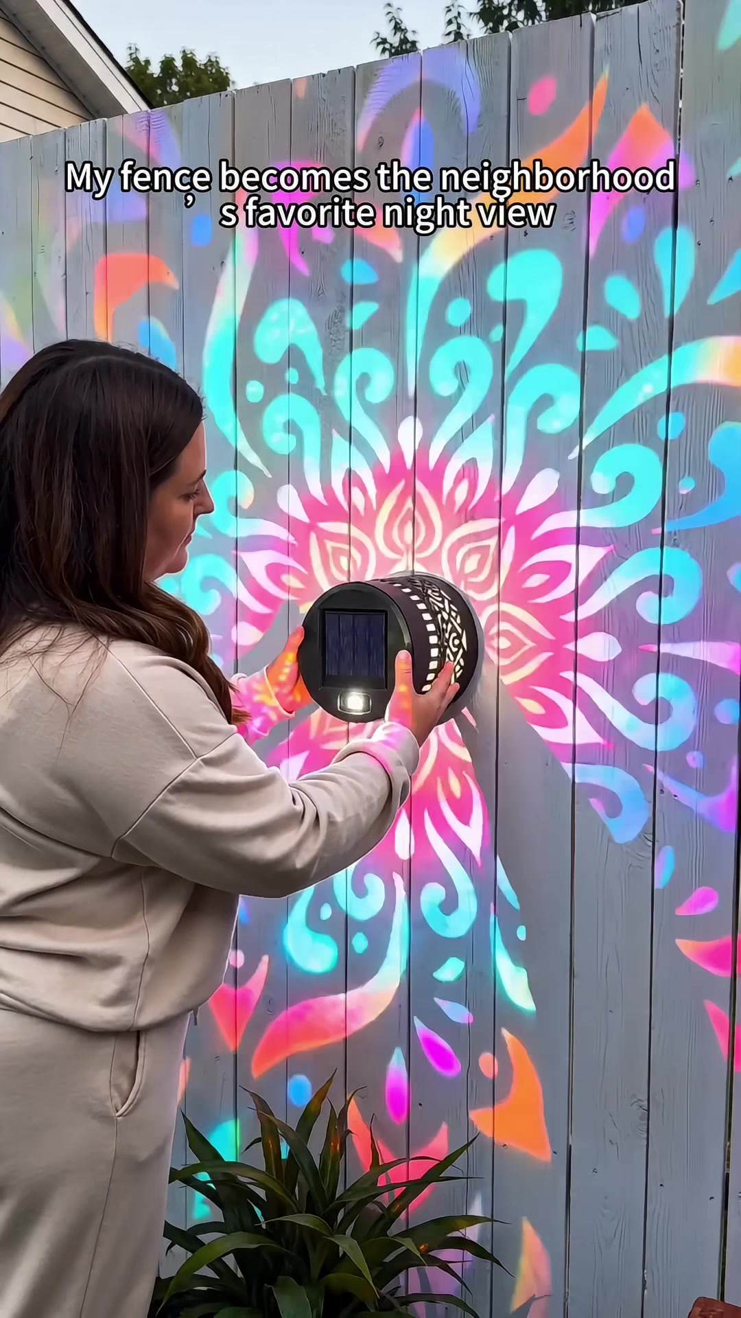 Solar mandala wall light closeup on house wall
