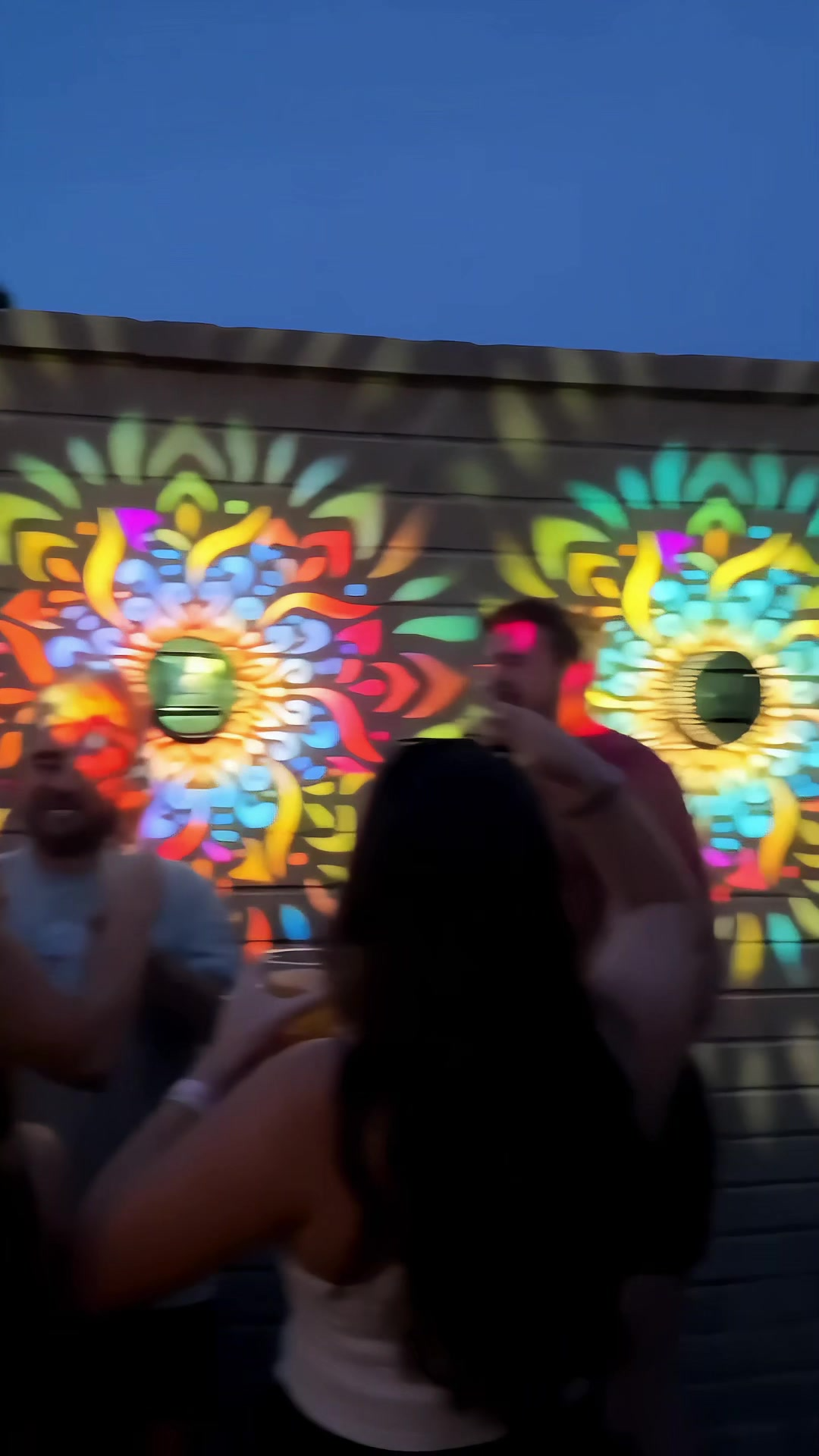 Solar mandala lights with people in backyard